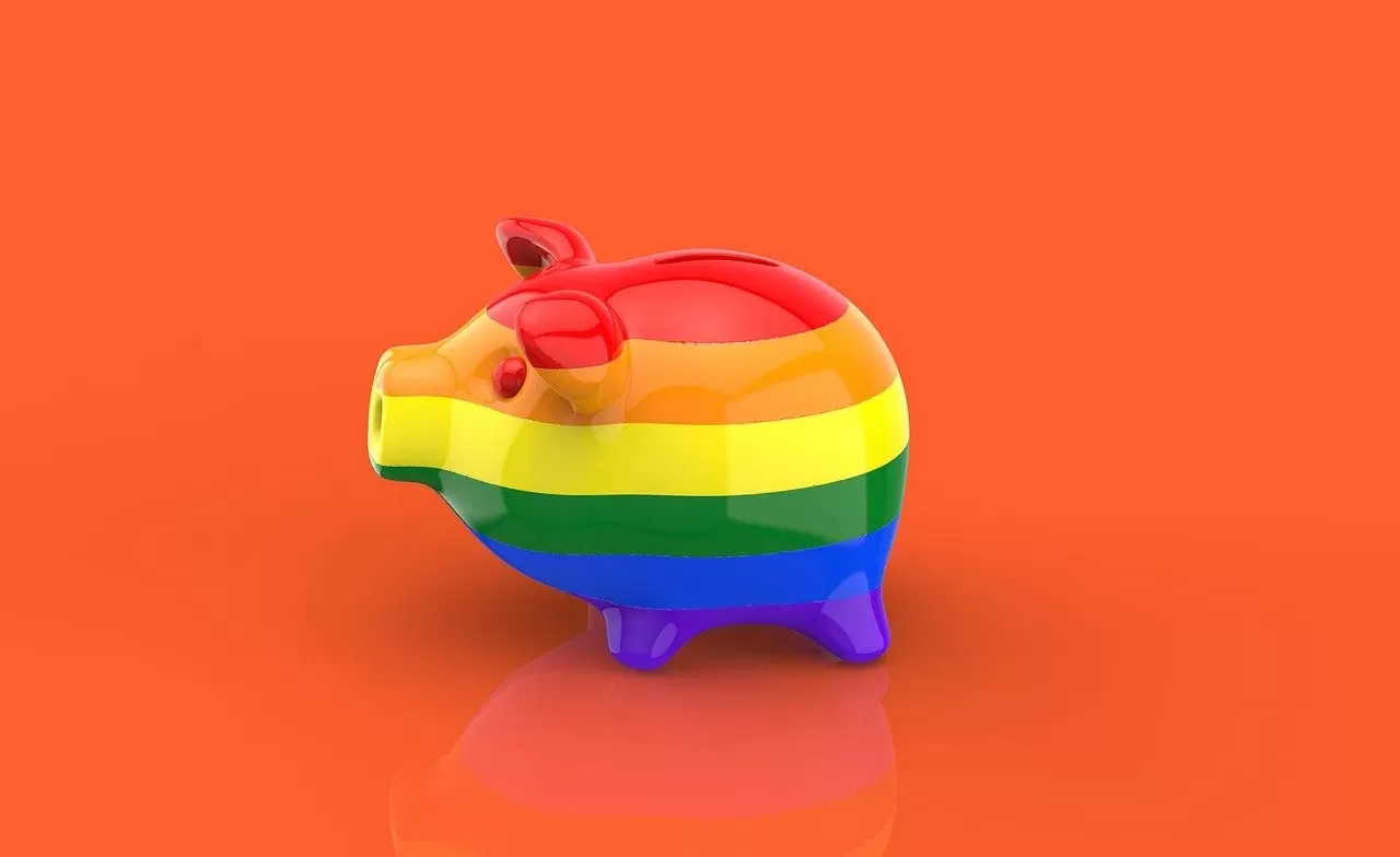 a photo of a piggy bank painted with a pride flag